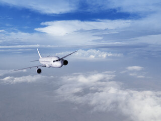 Fototapeta na wymiar Airplane flying in the blue sky 