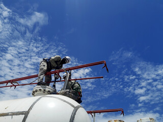 worker inspection at flange pipe of visual check record pipeline tank farm gas