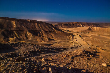 Full moon  night in the Judean desert near the town of Mitzpe Ramon in Israel - obrazy, fototapety, plakaty