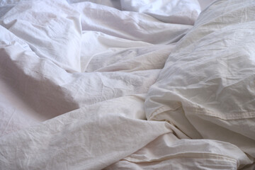 Fototapeta na wymiar White linens. Blanket texture. Suitable for backgrounds.