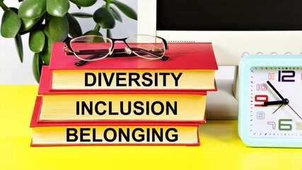 Diversity Inclusion Belonging. Text inscription on books. Business imperative, cultural value.