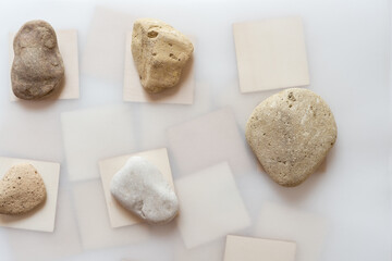 wooden shapes and stones on white