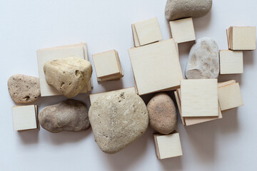 wooden shapes and stones on white