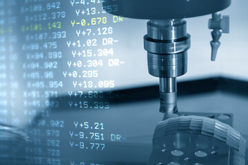 The abstract scene of CNC milling machine rough cutting  the injection mold parts and G-code data...