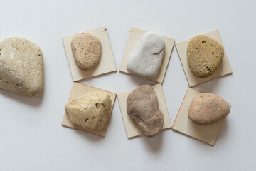 wooden shapes and stones on white