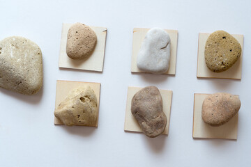 wooden shapes and stones on white