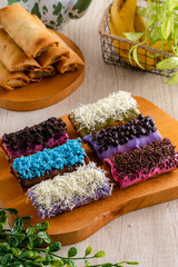 Piscok or banana chocolate is  traditional snacks from Indonesia. made of fried banana wrapped in spring roll skin and assorted melted 
toppings (Chocolate, Taro, Strawberry) 