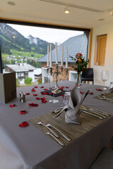romantic decoration in a room with table in the alps