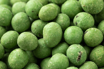 Spicy wasabi peanuts snack close up. background, texture