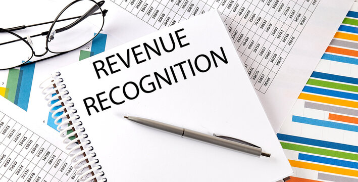 Revenue Recognition , pen and glasses on the chart, business concept