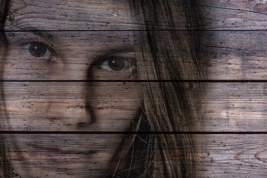 Double Exposure Of Young Woman Against a wooden background