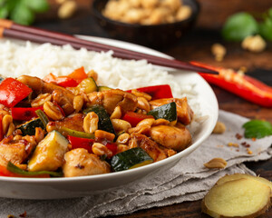 Kung Pao Chicken with Peppers, zucchini and rice. Asian take away food