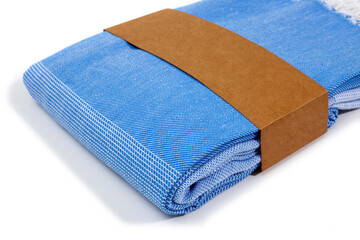 Blue Peshtemal Turkish towel folded colorful textile for spa, beach, pool, light travel, healthy fashion and gifts. Traditional turkish bath material