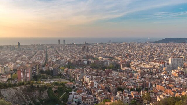 Barcelona Spain time lapse 4K, high angle view city skyline sunrise timelapse from Bunkers del Carmel