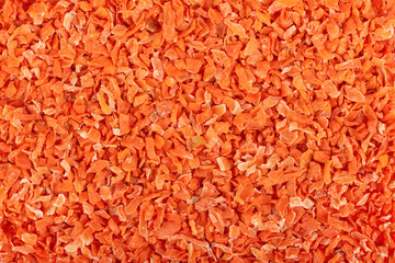 Dry carrot background. Chopped dried carrot. Spices and herbs.