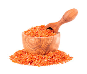 Dry carrot in olive bowl and scoop, isolated on the white background. Chopped dried carrot. Spices and herbs.