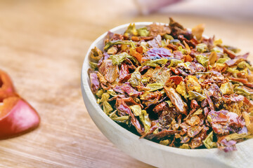 close-up of colorful seasoning and spices in wooden spoon on cutting board, cooking with seasonings and spices