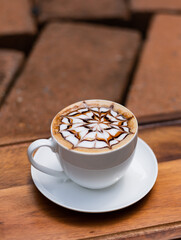 hot latte art coffee on wood table, relax time