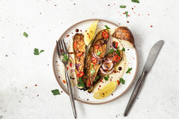 Grilled zucchini with sauce and tahini