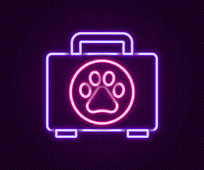 Glowing neon line Pet first aid kit icon isolated on black background. Dog or cat paw print. Clinic box. Colorful outline concept. Vector