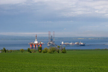 Fototapeta na wymiar Oil rigs in Cromarty Firth in the Scottish Highlands, UK