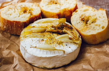 homemade DIY baked camembert with garlic.cheese with white mold.baked cheese.