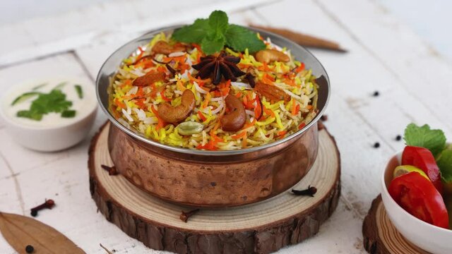 Vegetable biryani Spicy Indian Malabar biryani Hyderabadi biryani, Dum Biriyani pulao 4K slow motion video footage Kerala India Sri Lanka basmati rice mixed rice dish meat curry Ramadan Kareem, Eid