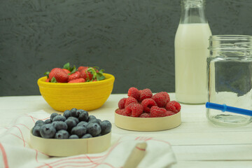 Berries and fruits on the table for making a cocktail