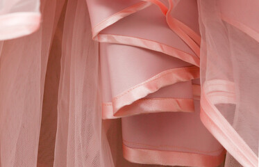 Wedding dress detail. Pink wedding dress frills close up.