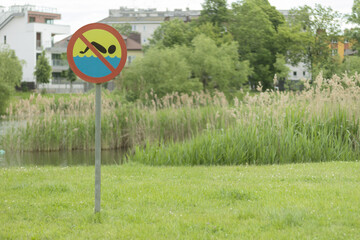 Sign on the shore of the reservoir: swimming is prohibited