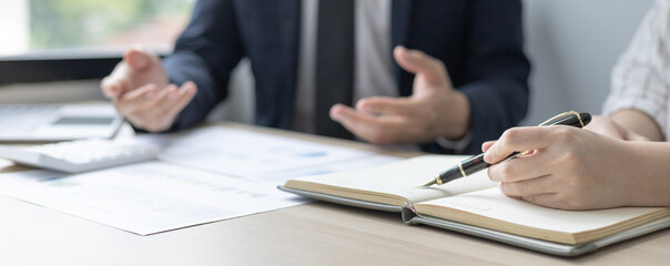 Brainstorm team, Marketers and financial accountants are discussing and analyzing charts to plan strategies to meet customer needs, Team meetings or business consulting.