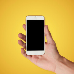 Hand holding a cell phone 