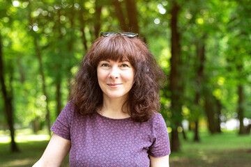 Fototapeta premium Portrait nice woman. Outdoor. Close up.