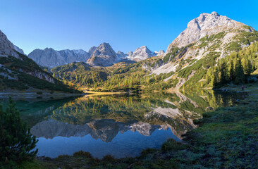 Fototapeta na wymiar morning scenery lake Seebensee, reflecting mountain range in the water. hiking destination Ehrwald