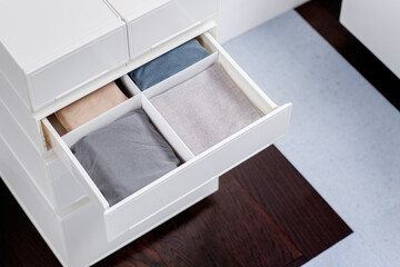 Bedding drawer organizer in bedroom