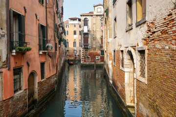 Fototapeta na wymiar Old traditional Venetian buildings on the rio della Fava canal in Venice, Italy