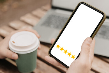 Customer service concept. Man with 5 stars score on his phone. Online ranking system.