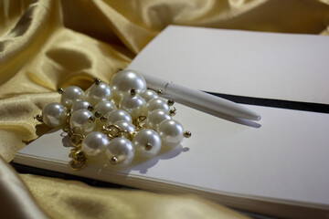 Blank notebook with pen on yellow silk pearl atmosphere of thought interior for blog