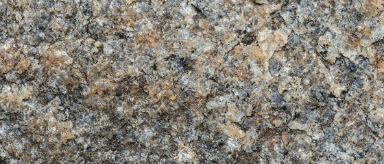 Texture of the rocky surface. Granite texture as nature background. Natural gray granite with a grainy pattern