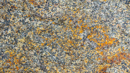 Texture of the rocky surface. Granite texture as nature background. Natural gray granite with a grainy pattern