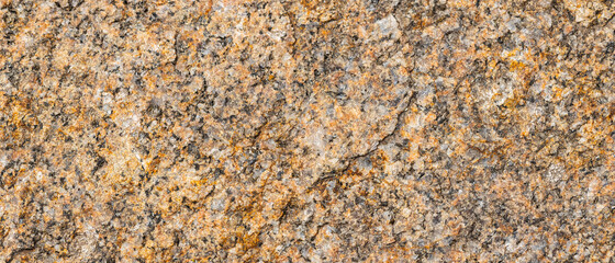 Texture of the rocky surface. Granite texture as nature background. Natural gray granite with a grainy pattern