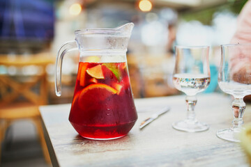 Big jar of delicious cold sangria, alcoholic beverage made from wine and fruits
