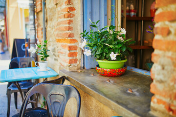 Flower pot decorating outdoor restaurant in Mediterranean town of Collioure