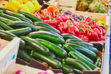 Fresh organic bell peppers and zuccinis on market in Paris, France