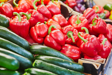 Fresh organic bell peppers and zuccinis on market in Paris, France