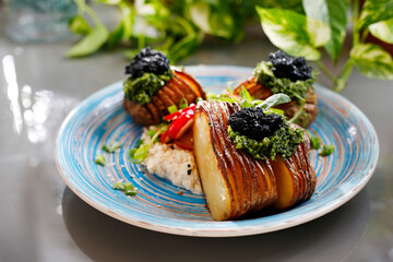 Baked potatoes with herb pesto and cottage cheese
Dish on a plate, food photography, serving proposal.