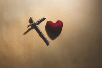 Wooden cross on paper background, Christian symbol concept.