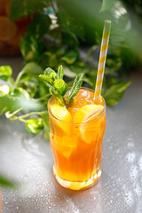 Vodka with orange dock and ice. Refreshing drink, culinary photography.