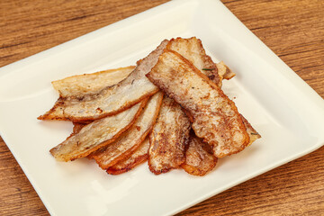 Roasted juicy bacon in the plate