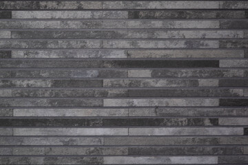 Grauer Steinhintergrund, geflieste in Blocke Wand aus dem schmalen Stein. Sehr gut geeignet als Hintergrund für diverse Grafiken, für den Baumarkt, Schwarz/graueStruktur.